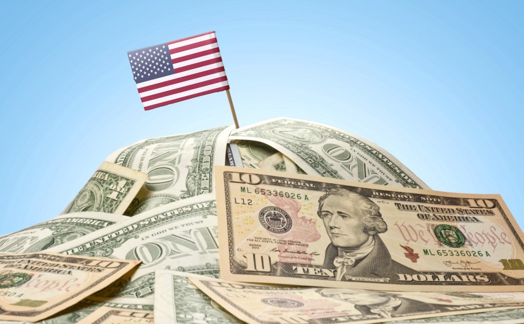 Image of a flag on top of pile of money